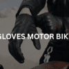 Motorcyclist wearing his motorbike gloves