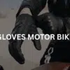 Motorcyclist wearing his motorbike gloves.
