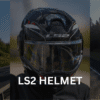 Motorcyclist wearing a LS2 helmet on a highway.
