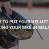 man holding helmet after parking